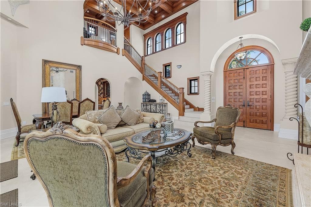 Living room looking at staircase towards foyer.