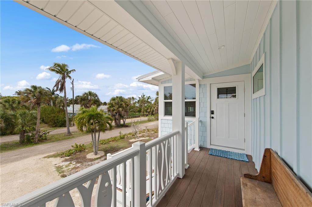 View of exterior entry with covered porch