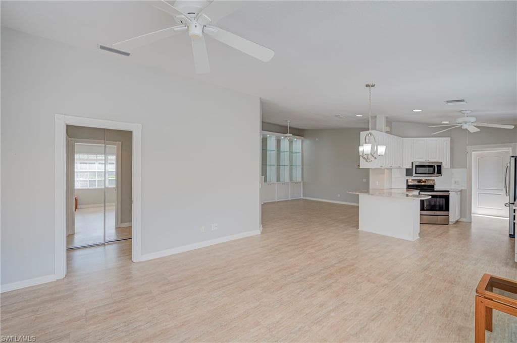 Looking into kitchen and towards Primary BR entry