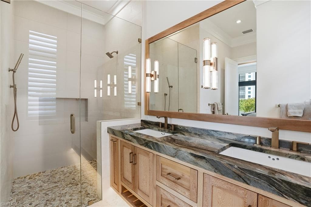 Full bath with a shower stall, double vanity, and ornamental molding - Virtually Edited Image