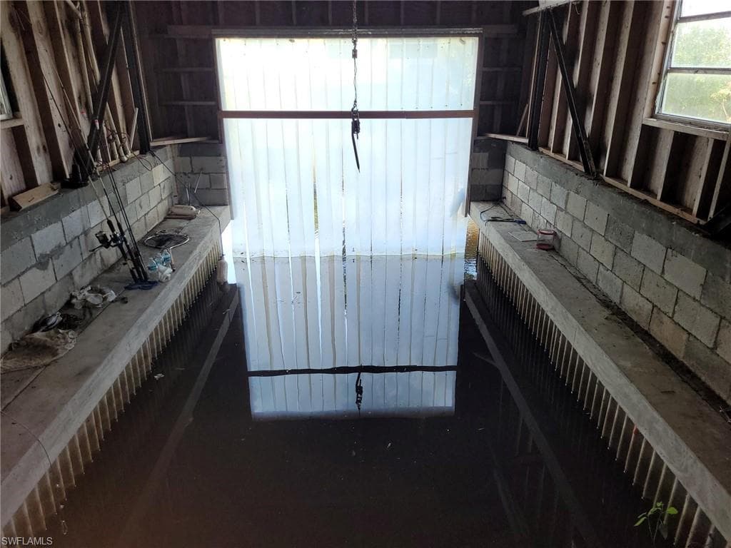 There are steel beams in the boathouse, a lift could be installed