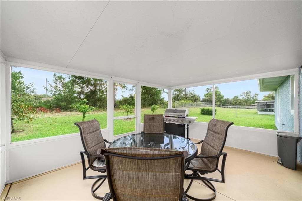 Sunroom with outdoor dining space