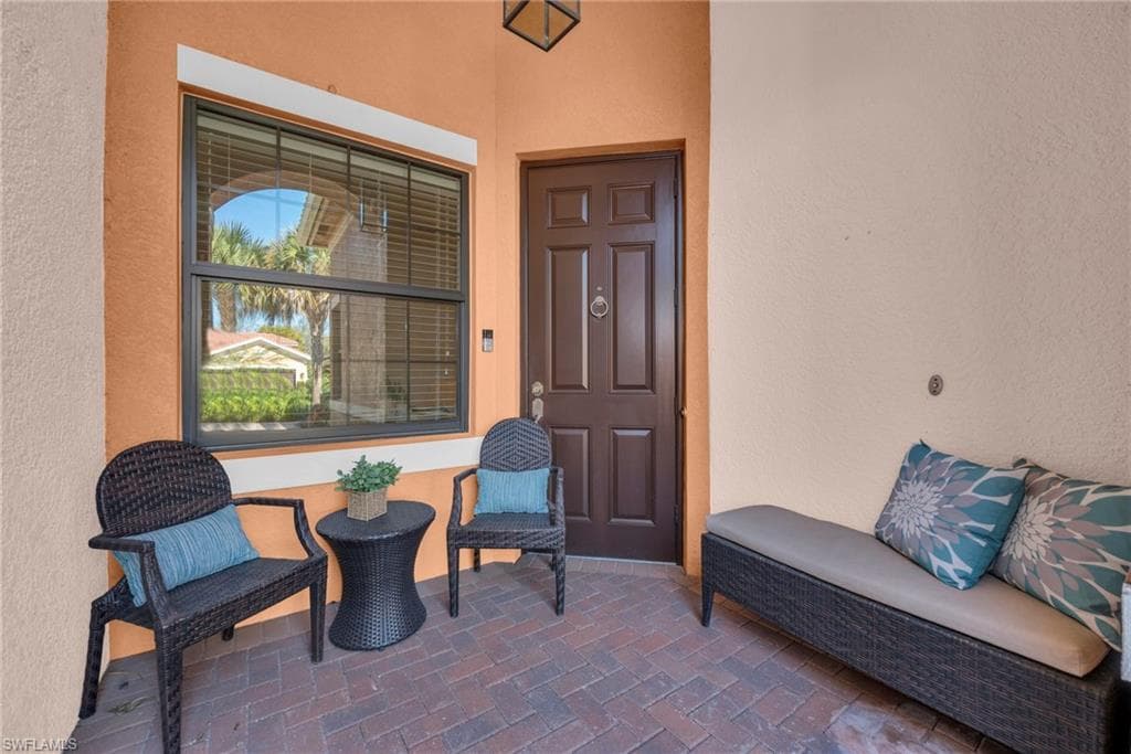Covered entry porch offering a welcoming space to relax and unwind.