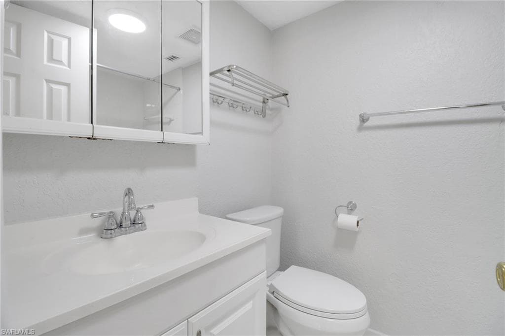 Bathroom featuring toilet and vanity