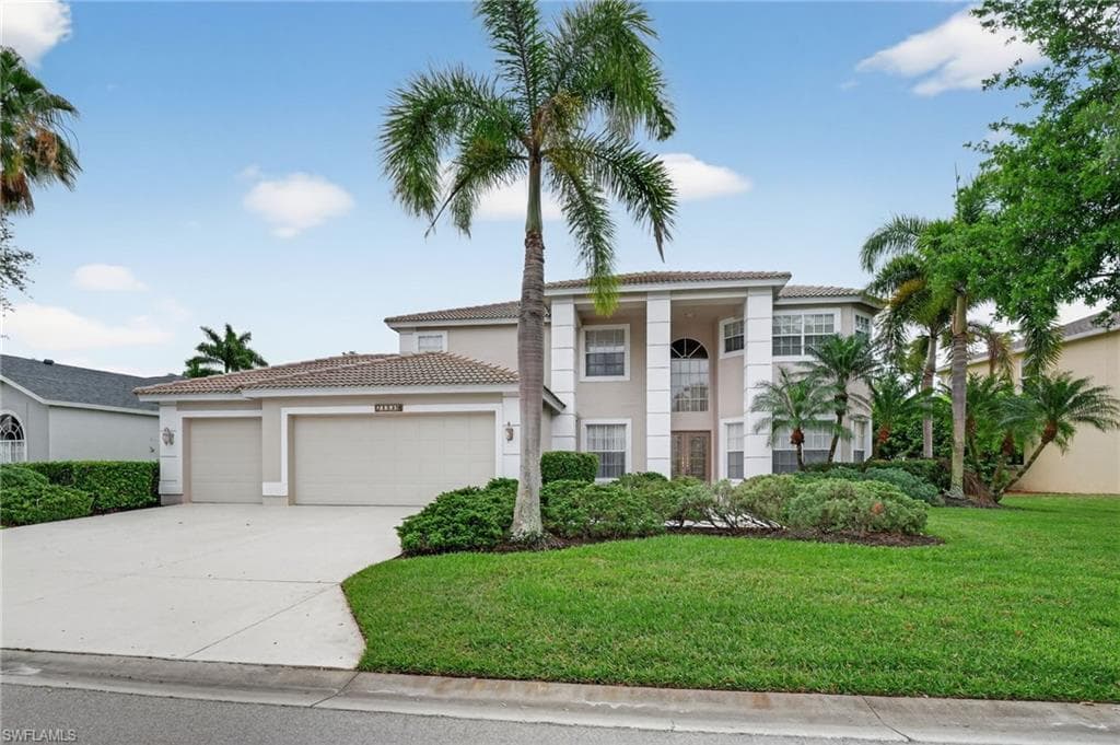 Lush landscaping, 3 car garage