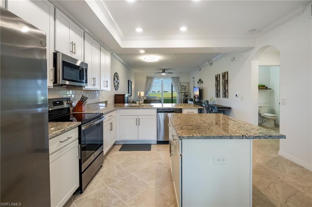 This open and airy condo is decorated in a relaxed coastal design and is move in ready.