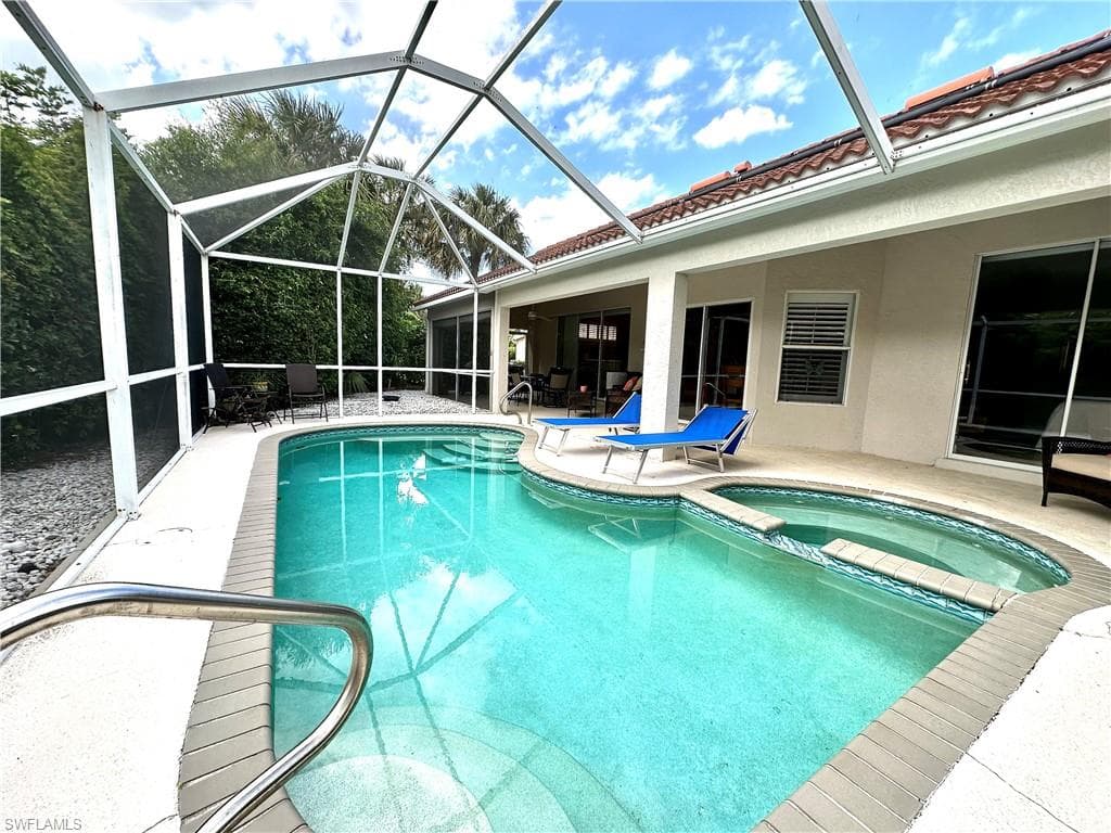 Home is designed for outdoor living with a pool and patio area that extends the full length of the house.
