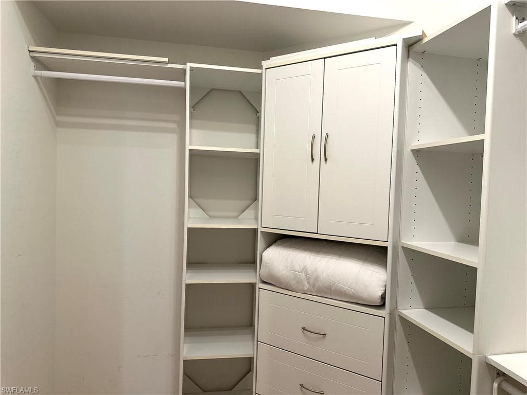 The main suite has a walk-in closet, plus a standard 6' closet. This is the left side of the walk-in closet.
