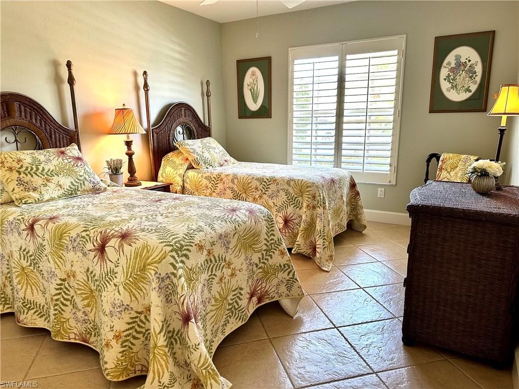 Bedroom no. 3 is furnished with twin beds. It has an Island or Tommy Bahama vibe.