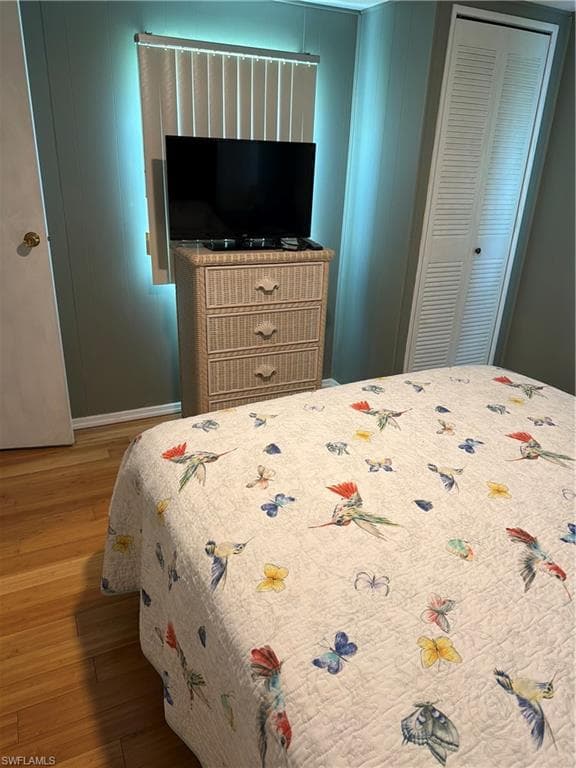 Hardwood-style flooring and paneled walls define this room