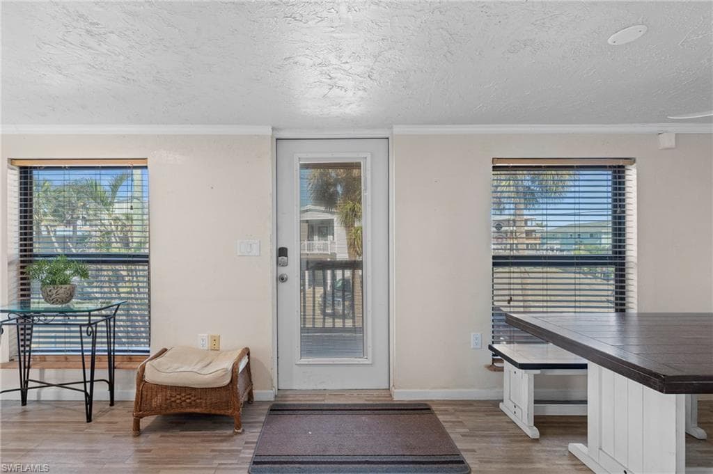 Entryway offering a glimpse of the outdoors and easy access to the deck area - Virtually Edited Image