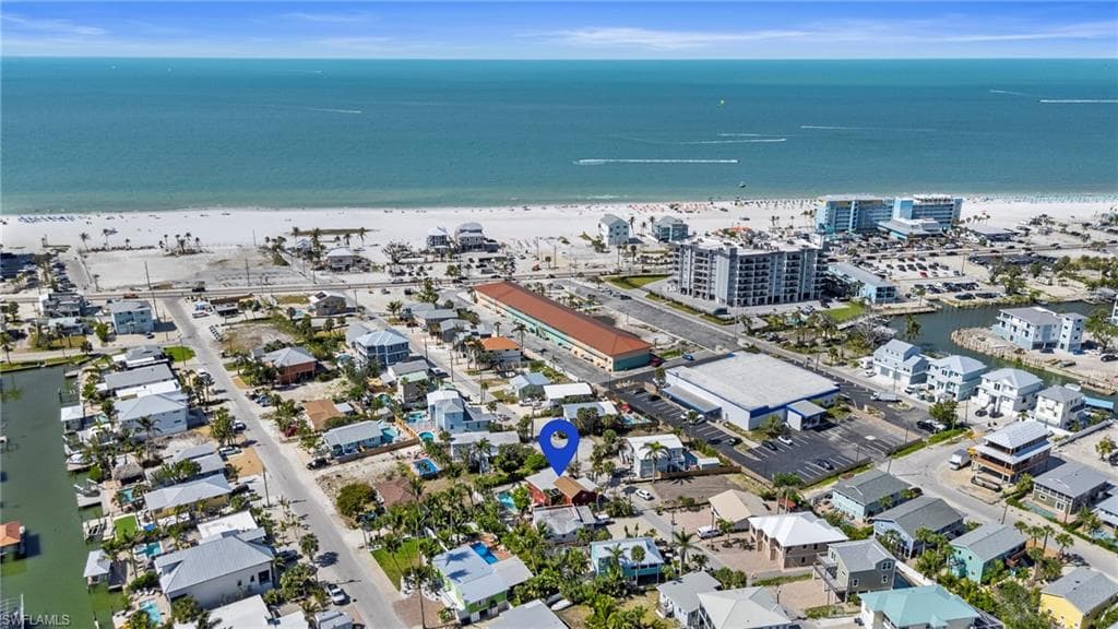Drone / aerial view with a view of the beach - Virtually Edited Exterior Image