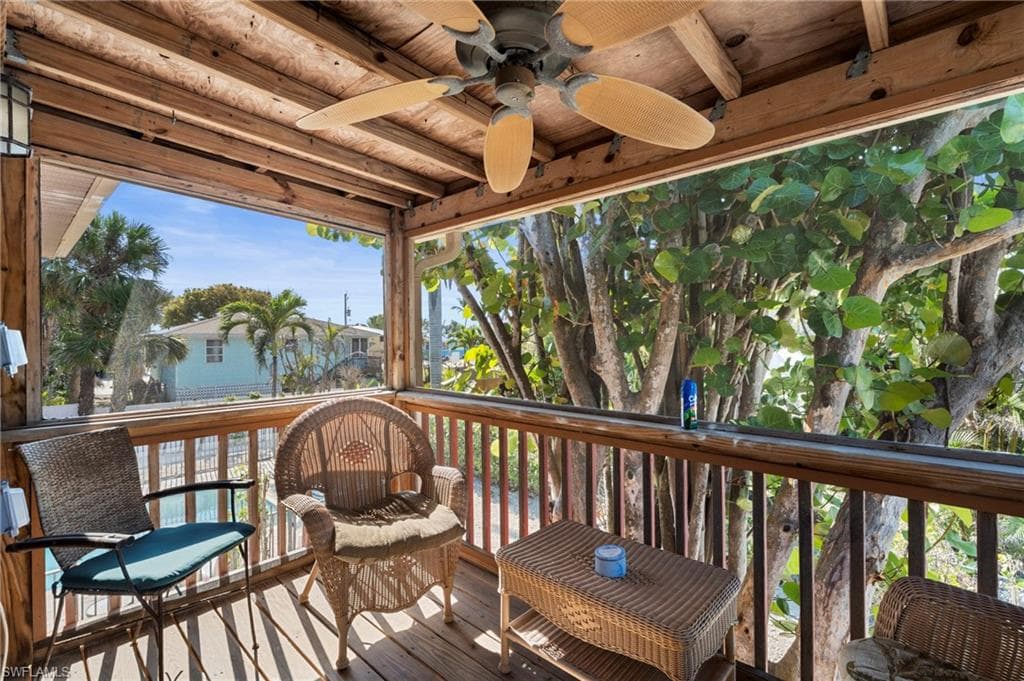 Screened-in porch —perfect for relaxing in the shade while enjoying the lush, tropical surroundings - Virtually Edited Image