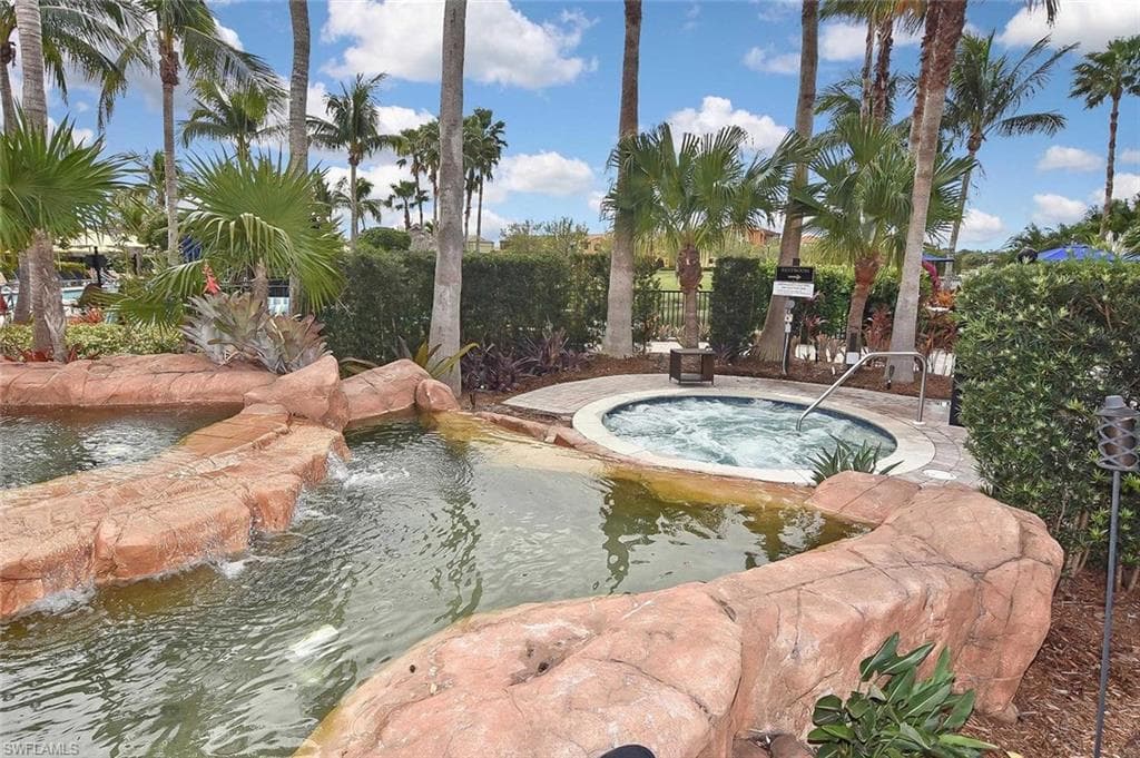 Take a dip in the spa while enjoying the waterfall grotto.