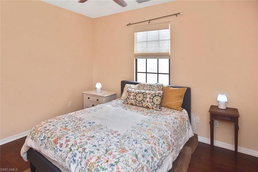 The guest bedroom at the opposite end of the hall near the top of the stairs is also painted in calm tones conducive to a good night's sleep.