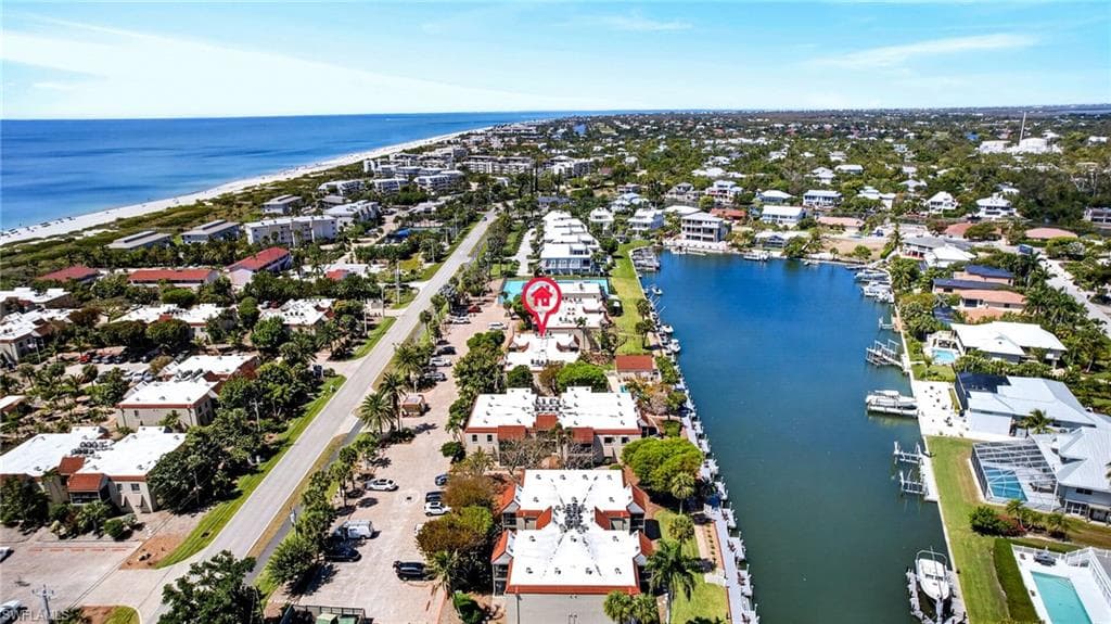 Aerial perspective showcasing coastal proximity, waterways, and residential properties
