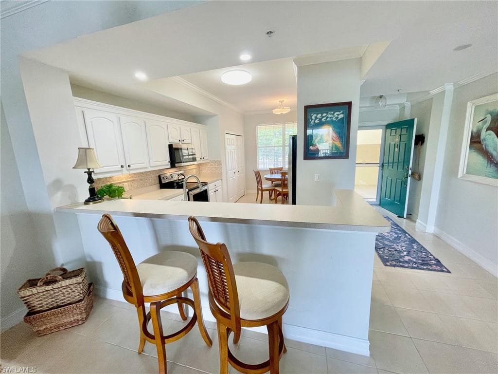 Kitchen featuring Breakfast Bar