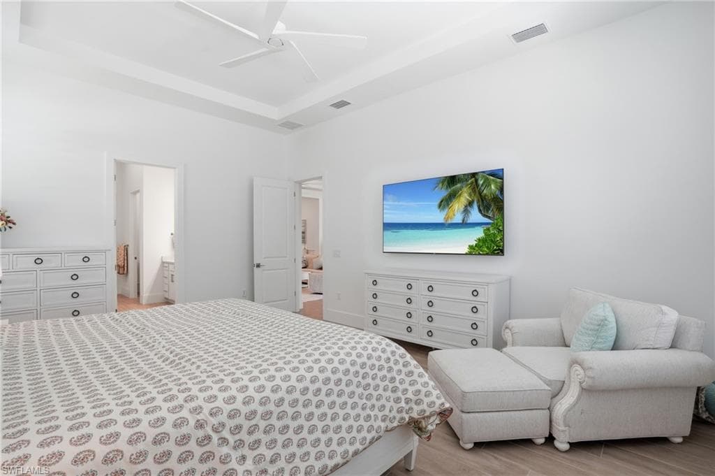 Recessed ceiling with an overhead fan, offering direct access to two separate rooms