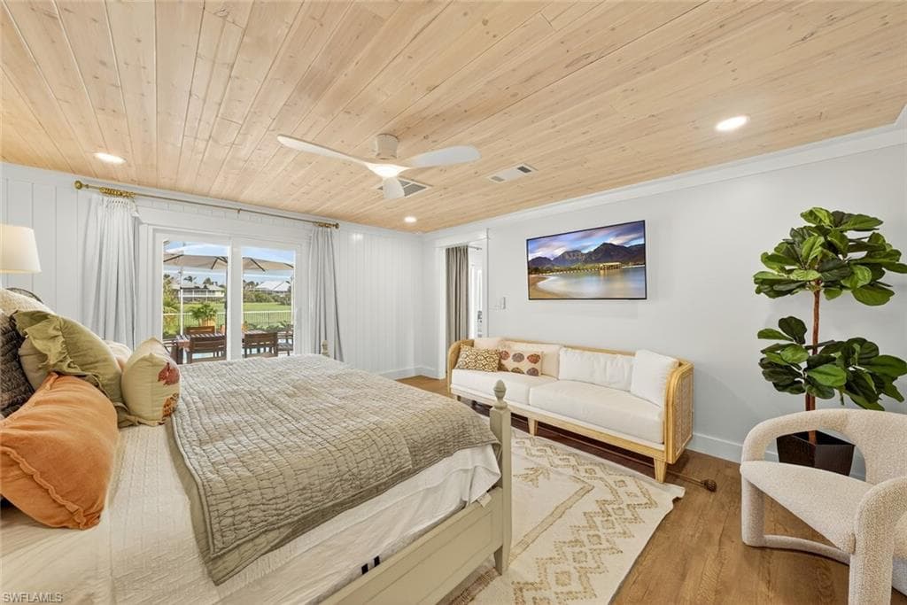 Sliding glass doors opening to an outdoor patio with additional seating, wood-finish flooring, a wood plank ceiling, recessed lighting, and a ceiling fan