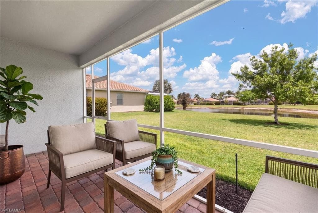 Virtually staged lanai showing potential outdoor living use with lake view.