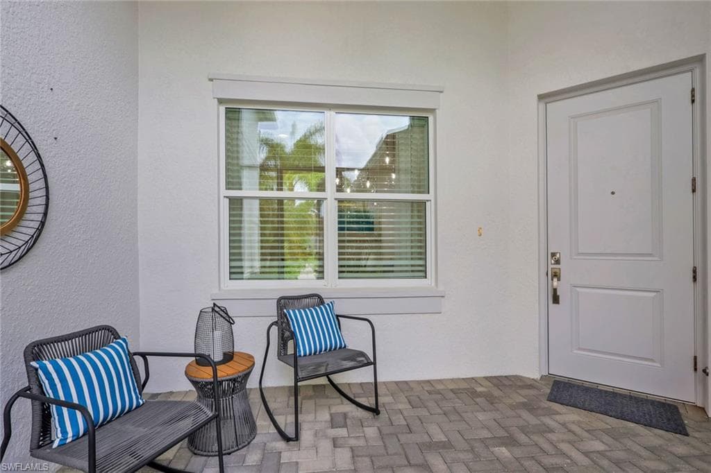 Covered entry with gray paver flooring