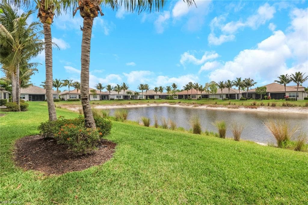Lush green landscaping bordering a tranquil water feature