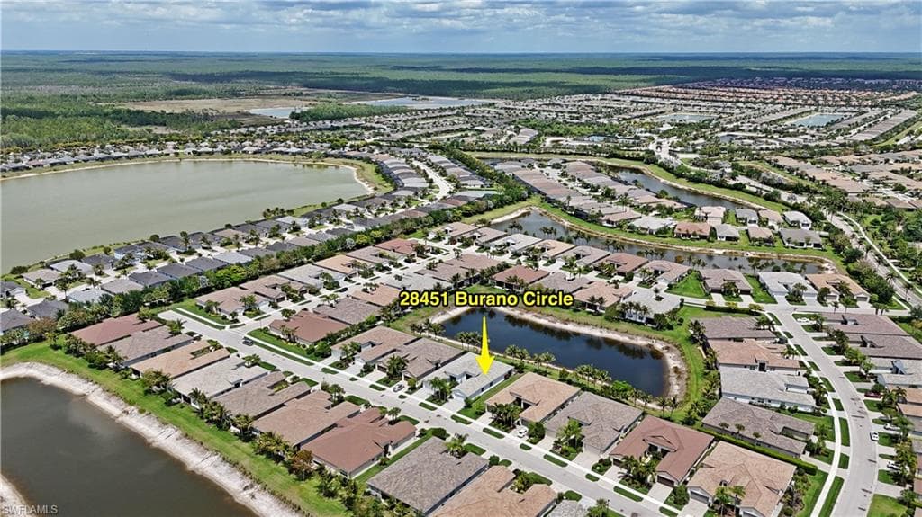 Aerial perspective showcasing a residential community with numerous single-story homes