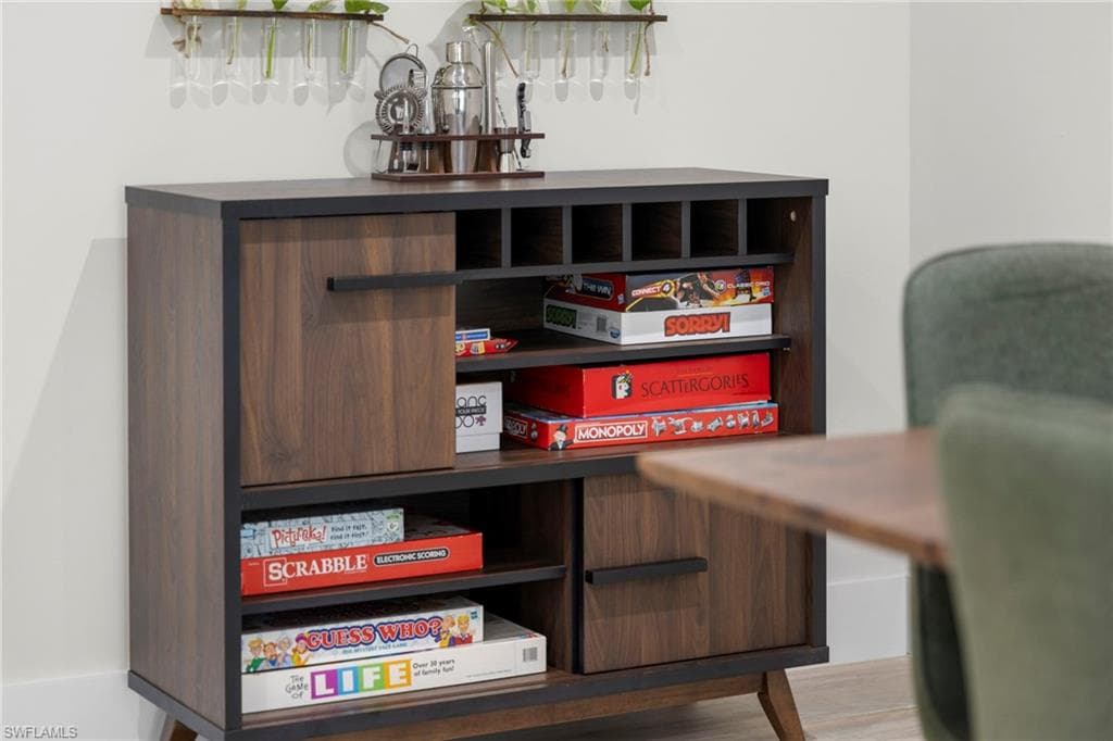 Wood-finish storage cabinet with integrated shelving and closed-door compartments