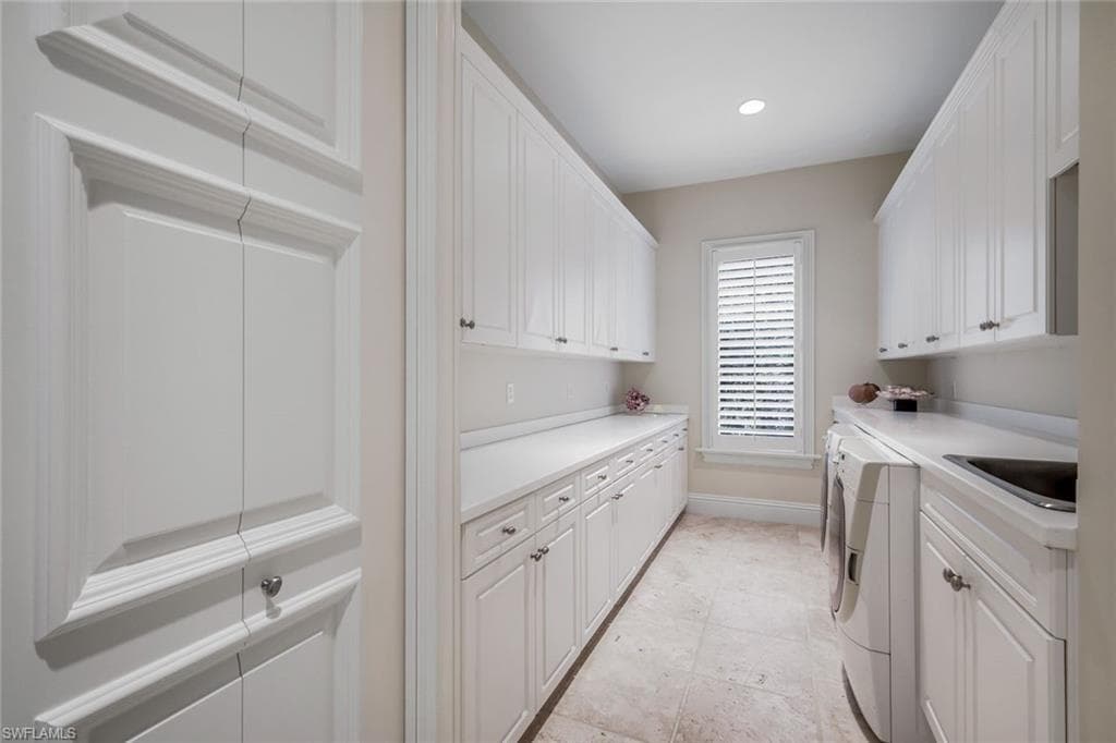 Utility Room w/ Large Closet & Extensive Cabinetry