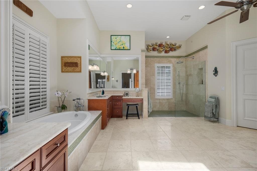 Marble-Topped Tub Surround, Dual Vanities & Makeup Vanity