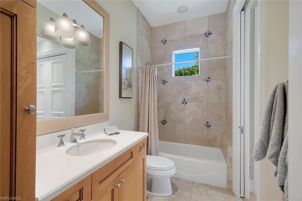 En-Suite Bath w. Custom Vanity/Mirror & Stone Tile to Ceiling