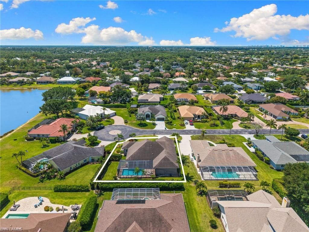 Single-story residence featuring a private pool with screening enclosure, a private driveway, and a cul-de-sac location
