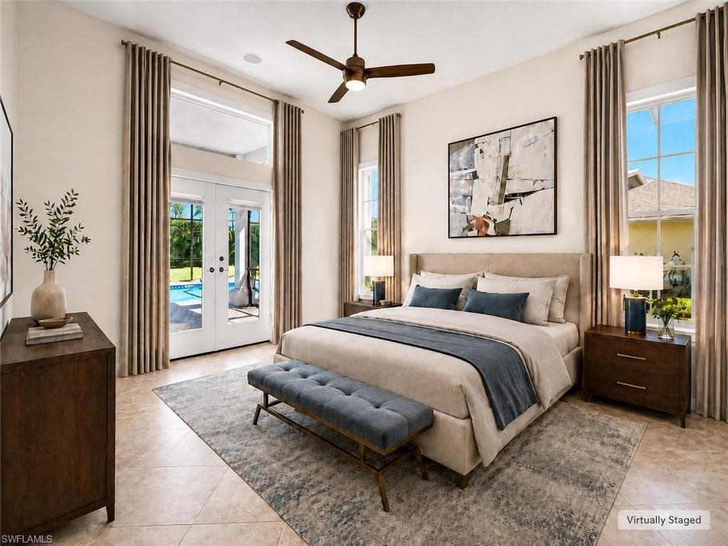 Open-concept living space featuring wood-finish flooring, a kitchen pass-through with a granite-look counter, built-in double ovens, a wine rack, and high ceilings with recessed lighting and ceiling fans