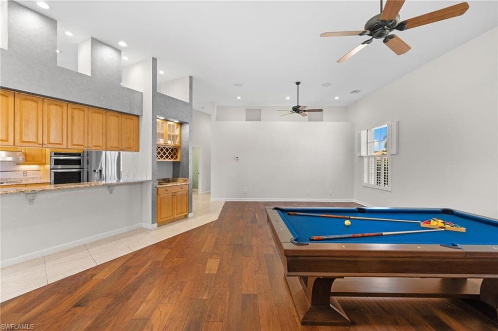 Spacious interior with vaulted ceilings and wood-finish flooring