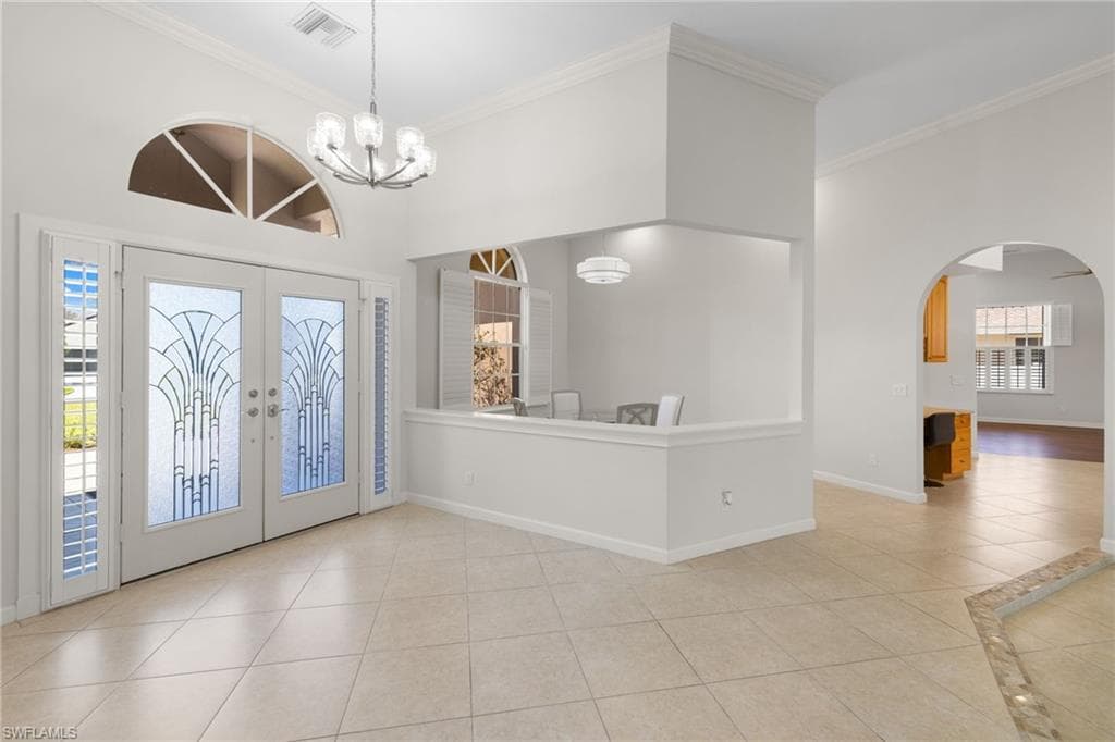 Spacious property featuring a screened-in swimming pool, mature landscaping, and a manicured lawn