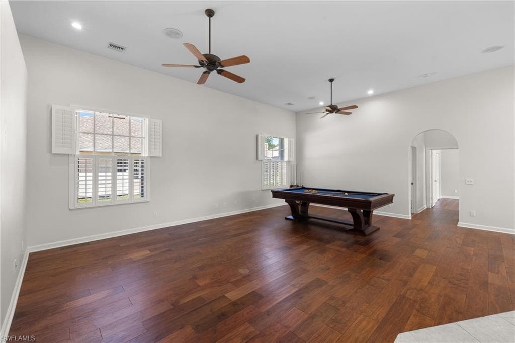 Kitchen featuring extensive wood cabinetry, stainless steel appliances, and a double oven
