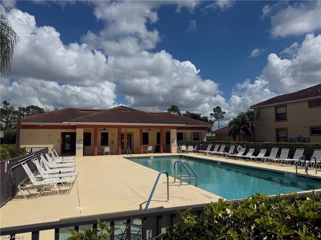 Resort-style swimming pool with integrated entry steps