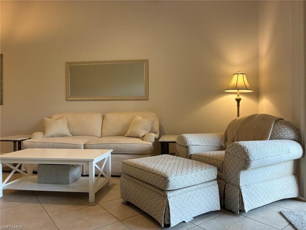 Neutral wall color and tiled flooring provide a versatile foundation