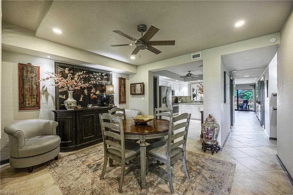 Dining area with recessed lighting and a ceiling fan