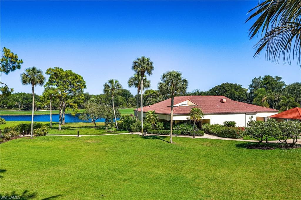 Peaceful green space overlooking the clubhouse and tropical surroundings, perfect for enjoying the outdoor Florida lifestyle.