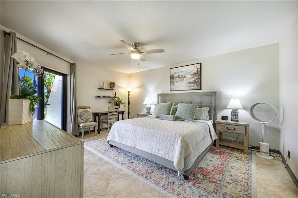 Bright and inviting primary suite with private terrace access and abundant natural light, creating the perfect Florida retreat.