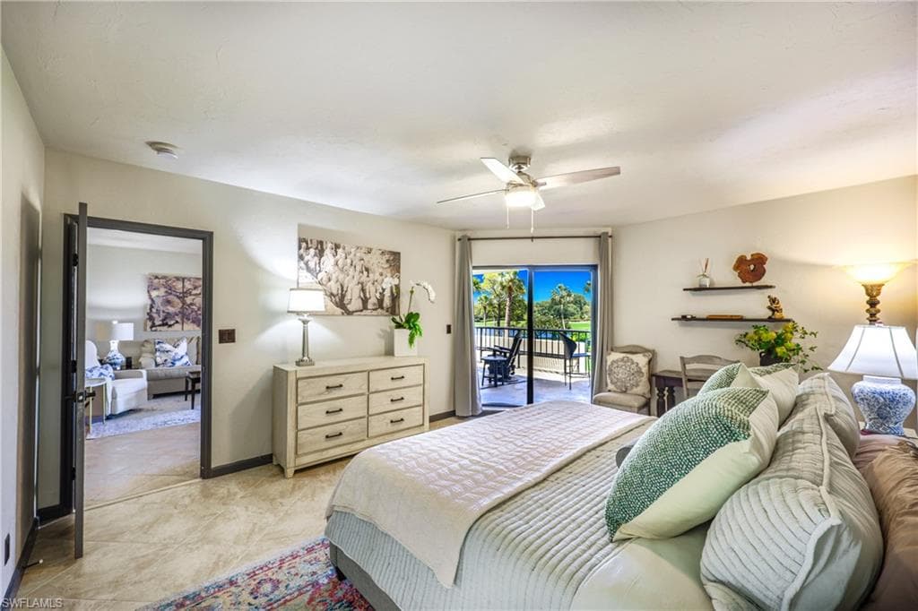 Bright interior space featuring a ceiling fan, tiled flooring, and a glass sliding door opening to an outdoor patio
