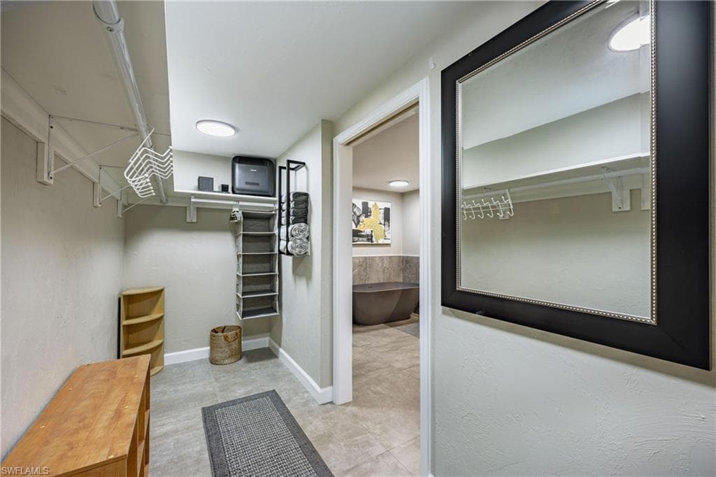 Thoughtfully designed walk-in closet providing ample storage and seamless access to the primary bath.
