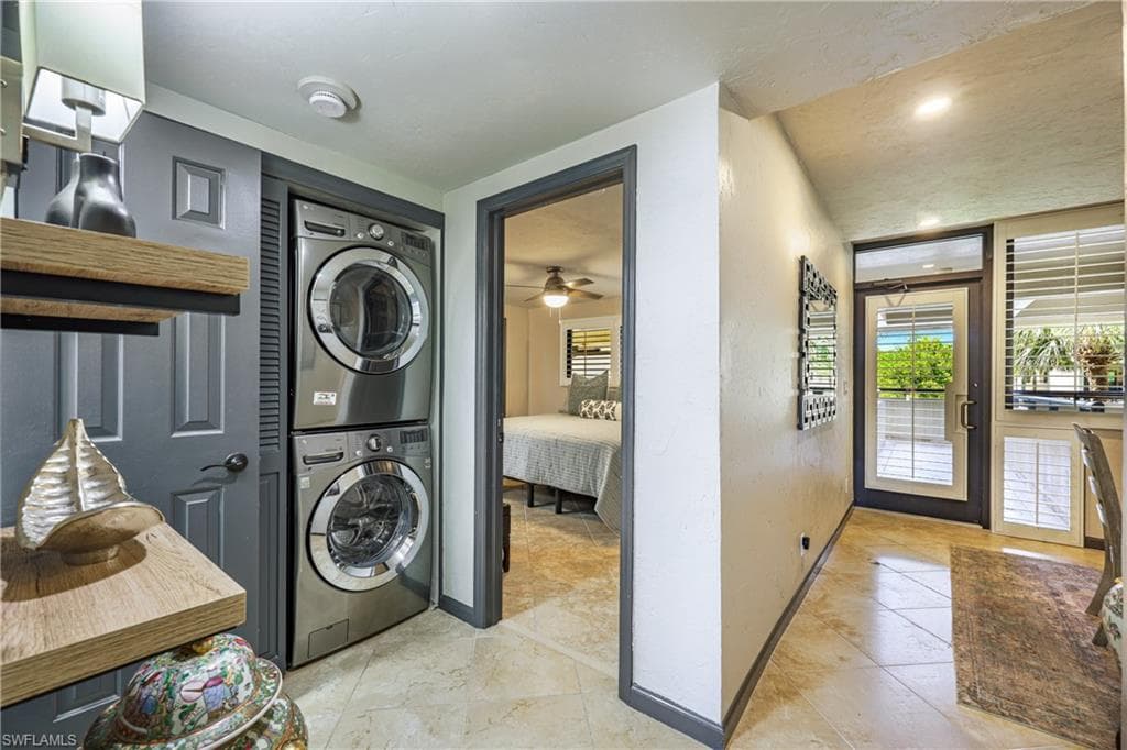 Well-designed interior laundry area with stacked washer and dryer for everyday convenience.