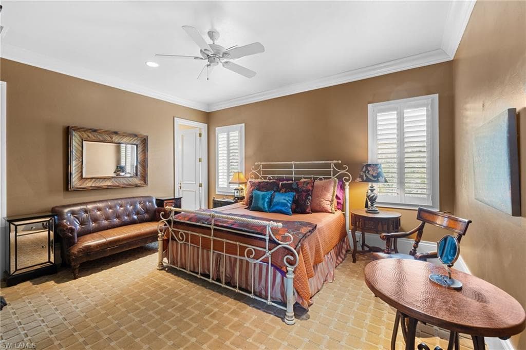 Interior room featuring textured flooring, crown molding, a ceiling fan with integrated lighting, and plantation shutters on the window