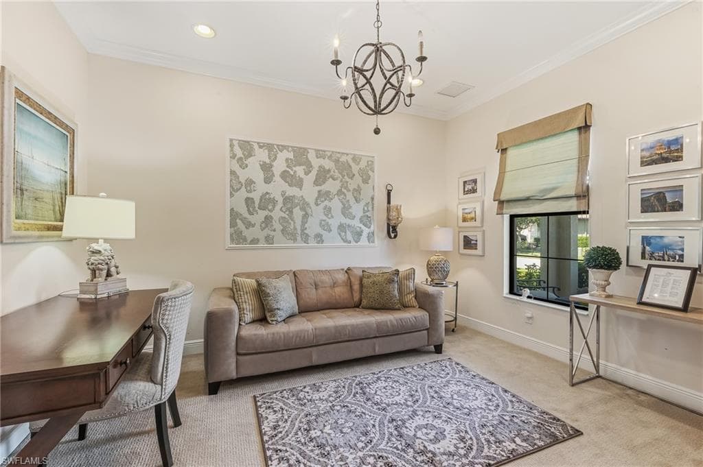 Interior room with light-toned walls, recessed lighting, and crown molding