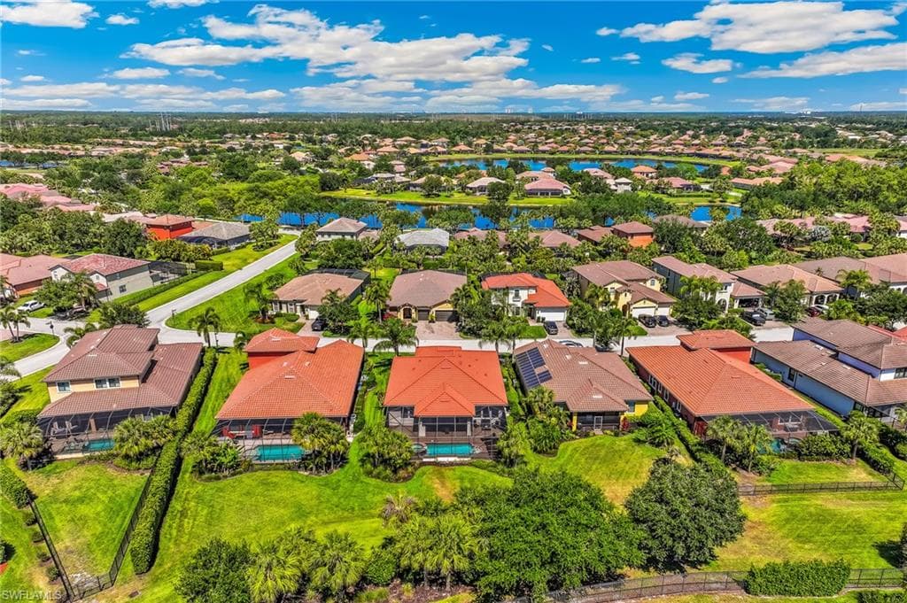 Aerial perspective showcasing a residential community with water features