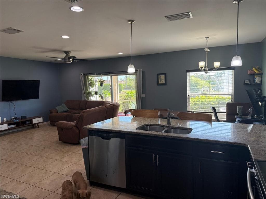 Open-concept living space featuring tile flooring throughout
