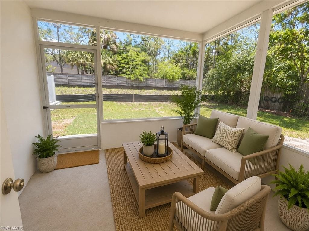 Screened porch with light-colored flooring, direct backyard access, and natural light