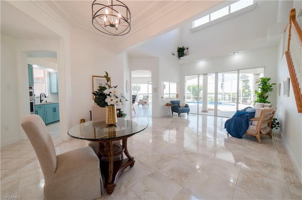 Wall of glass through living room and family overlooking bay